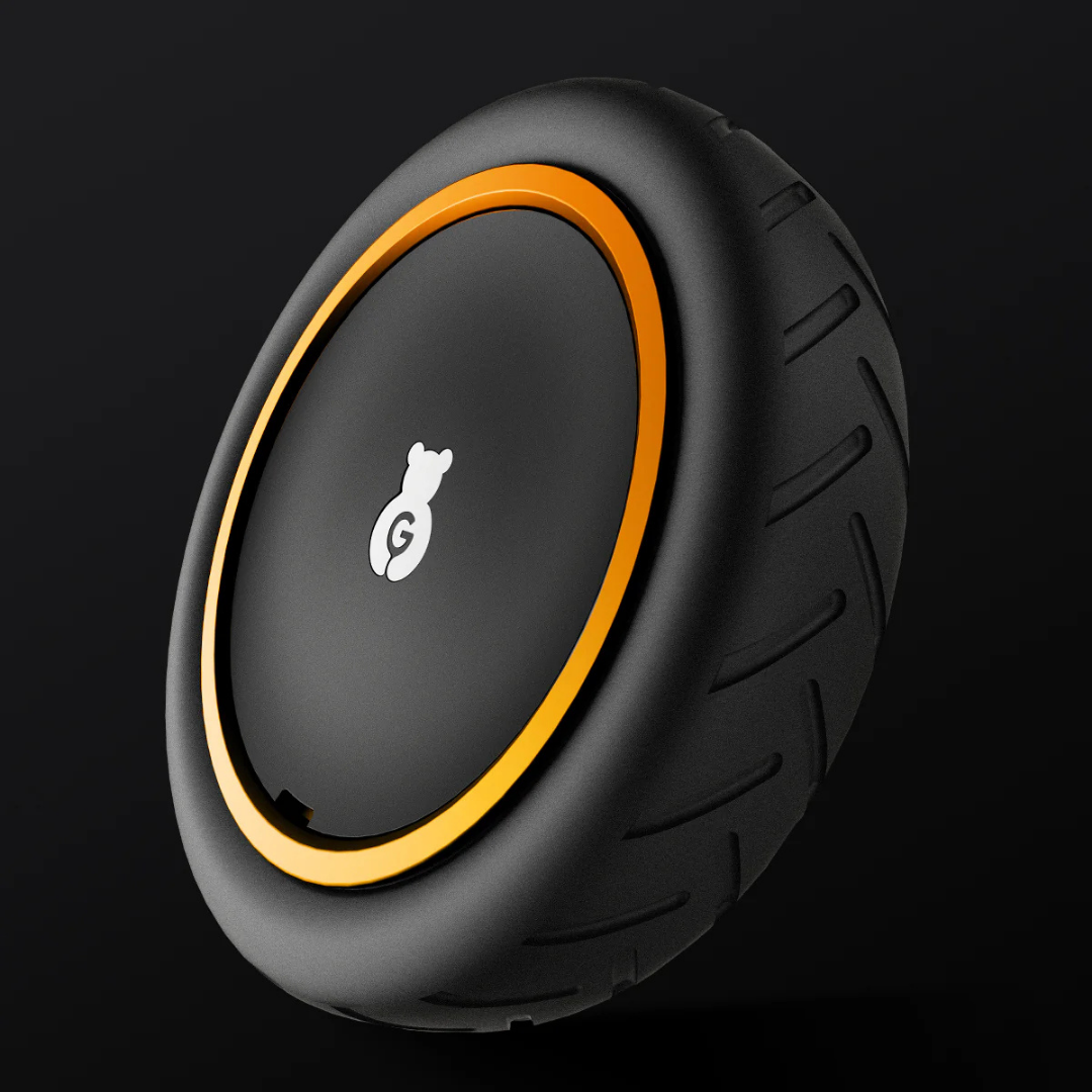 A sleek, black, futuristic Paiseec Electric Wheelchair Parts & Accessories wheel featuring a thick tread, an orange rim, and a bear logo in the center, displayed against a dark background.